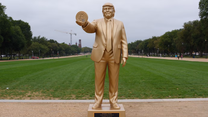 GOLDEN-TRUMP-STATUE-STIRS-CRYPTO-STORM-AFTER-FED-MOVE